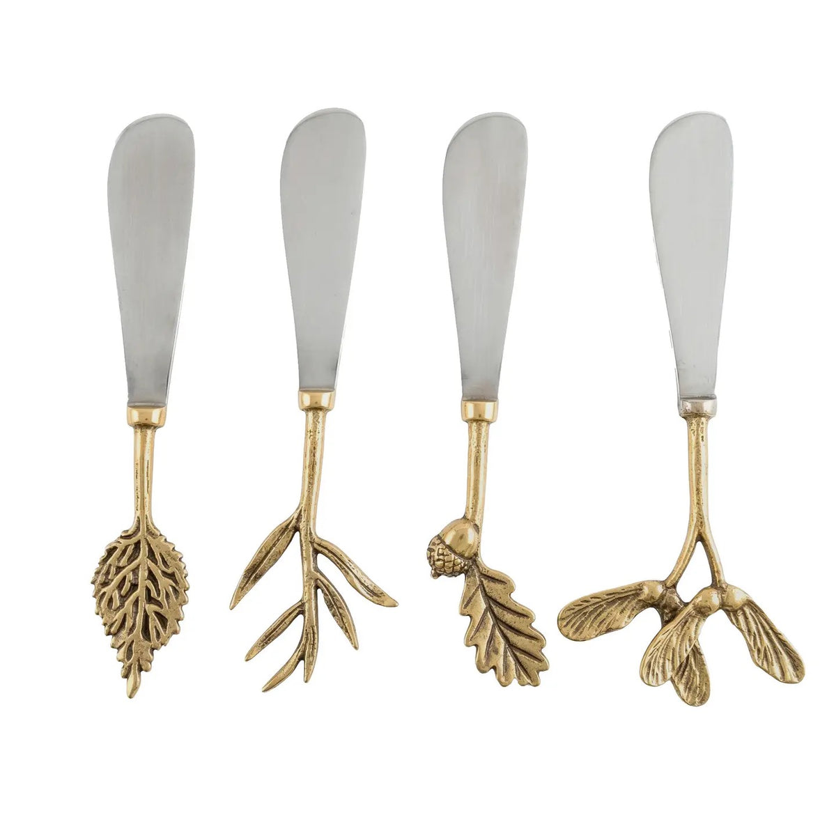 Four decorative spreader knives with silver-toned metal blades and ornate gold-toned handles shaped like leaves, branches, acorns, and birds, shown on a plain white background.