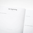 Book open to a page titled 'the beginning' on a white background