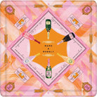 A square decorative print or scarf-like design featuring a pink and orange abstract background with a central diamond motif. The design includes illustrated champagne bottles, small cards, and repeated text such as 'BAMS & BUBBLY' and 'PLAY MUSHROOMS,' arranged in a symmetrical pattern.