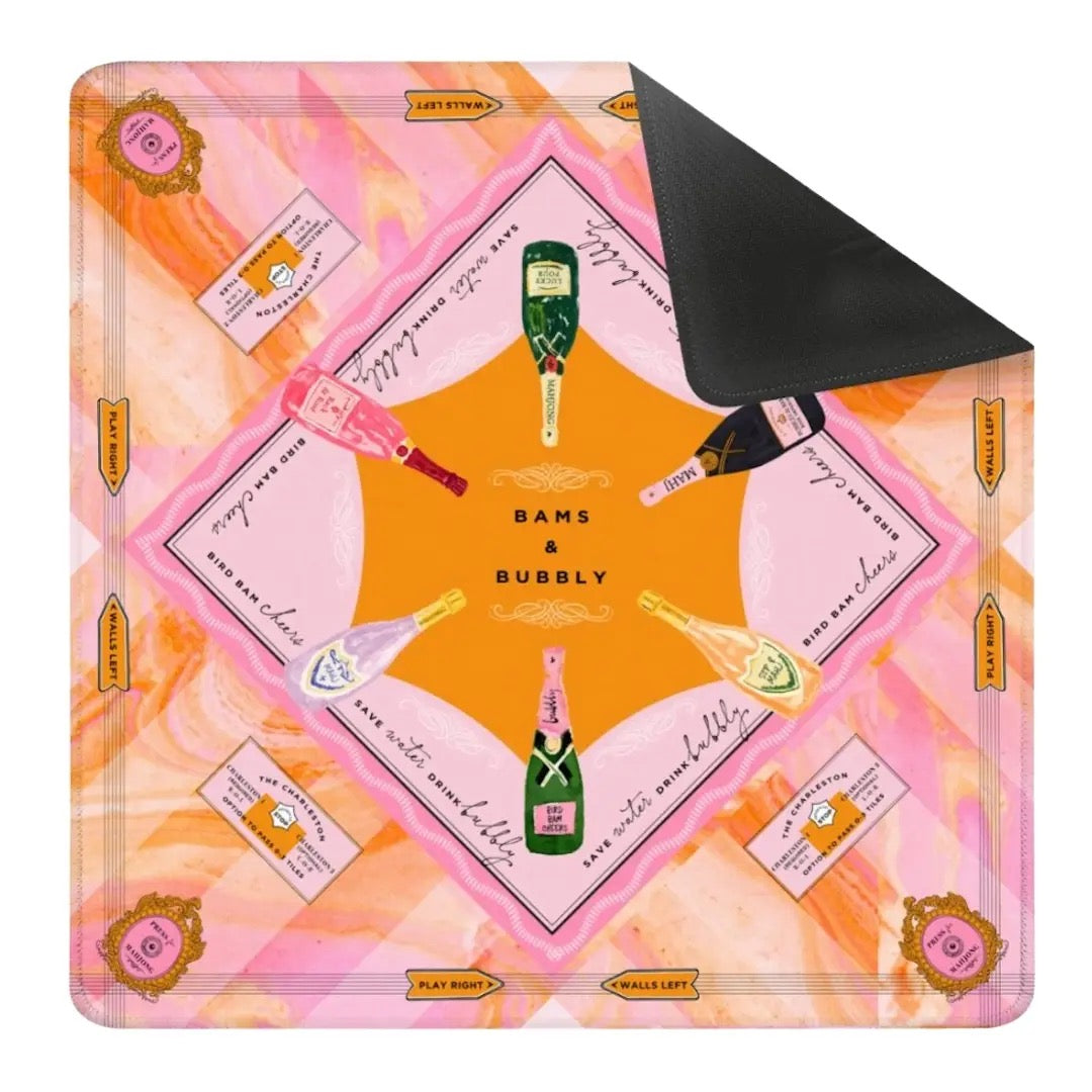 Decorative tray with champagne bottle design and 'Bams & Bubbly' text on a pink and orange patterned background.