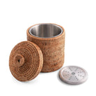 Woven container with metal lid and base on a white background