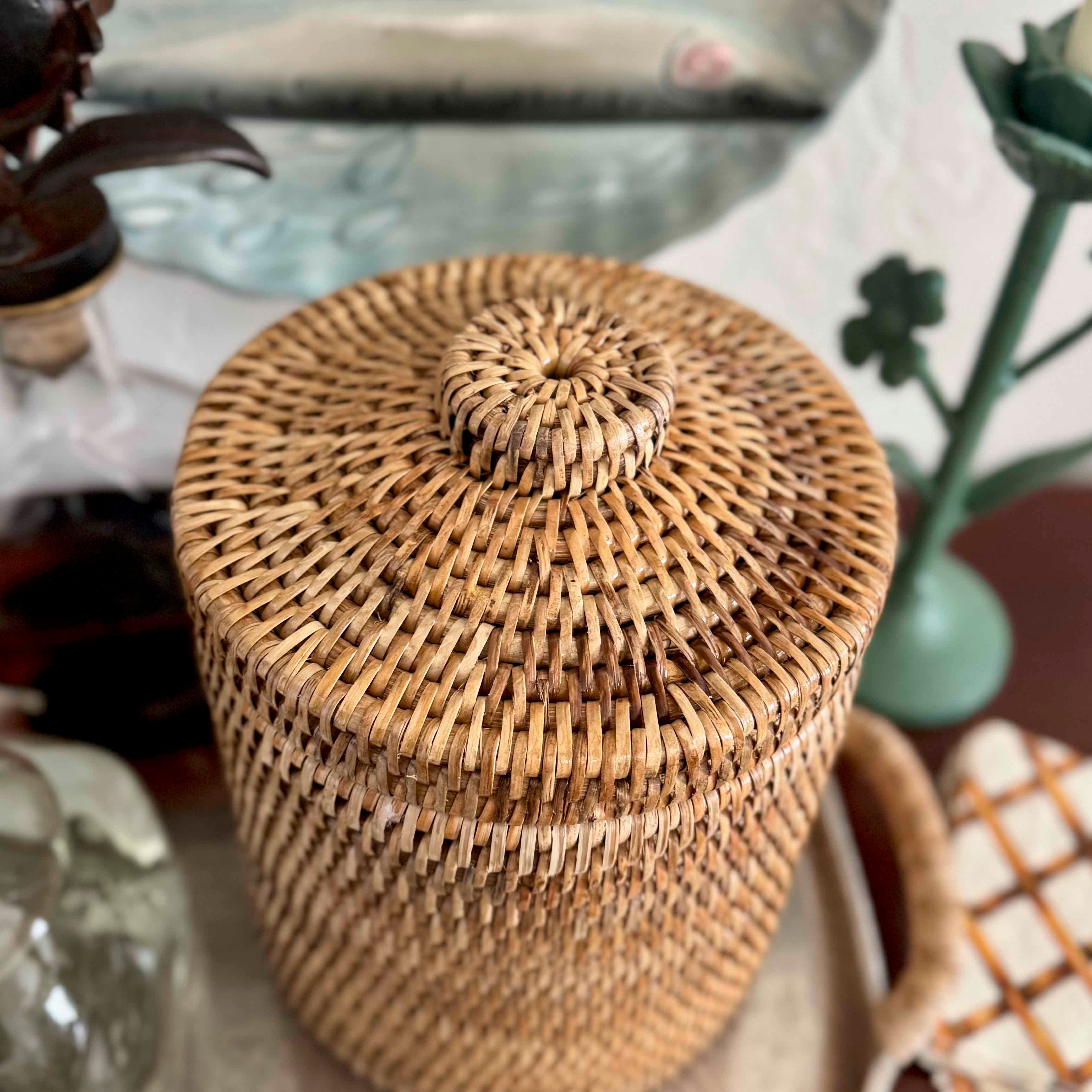 Woven basket with a lid on a blurred background