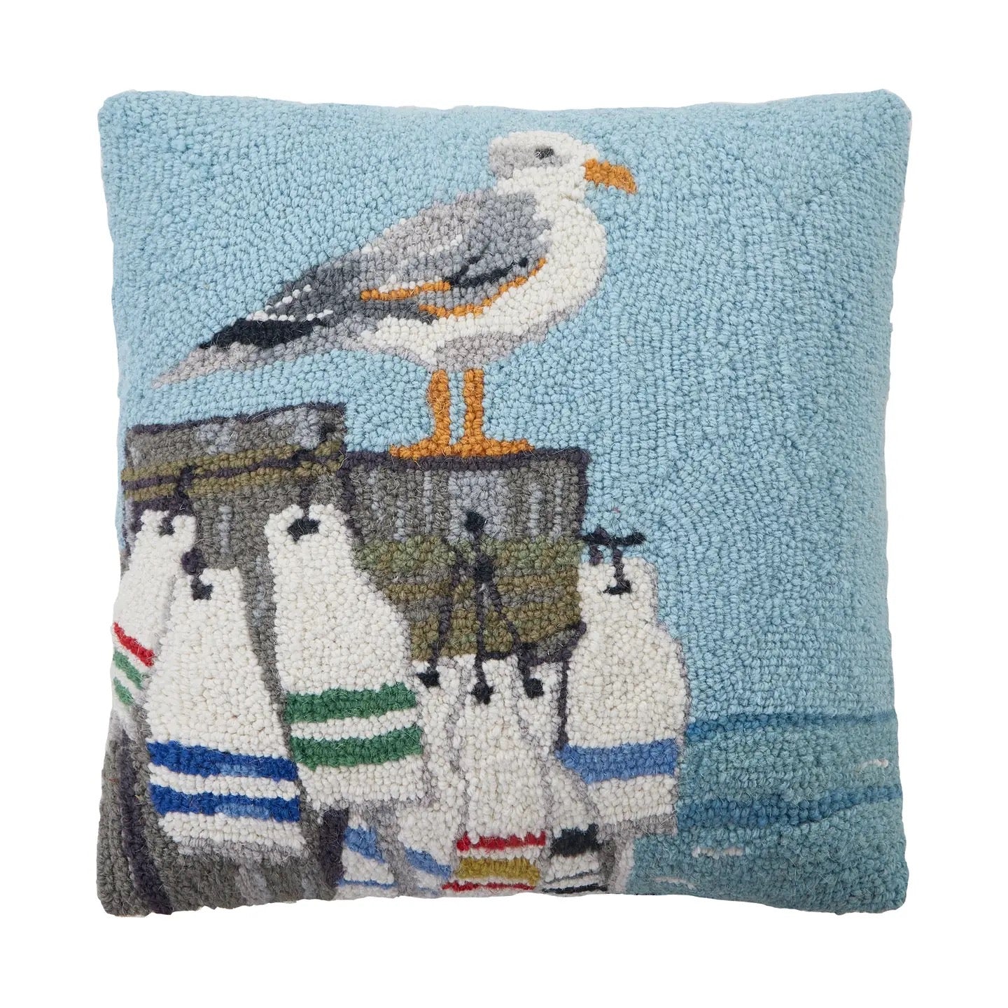 A square hand-tufted decorative pillow featuring a seagull standing on a dock with sailboats against a light blue background.