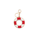 A beaded life preserver keychain charm featuring alternating red and white beaded stripes with a gold-tone metal clasp and key ring, shown on a plain white background.