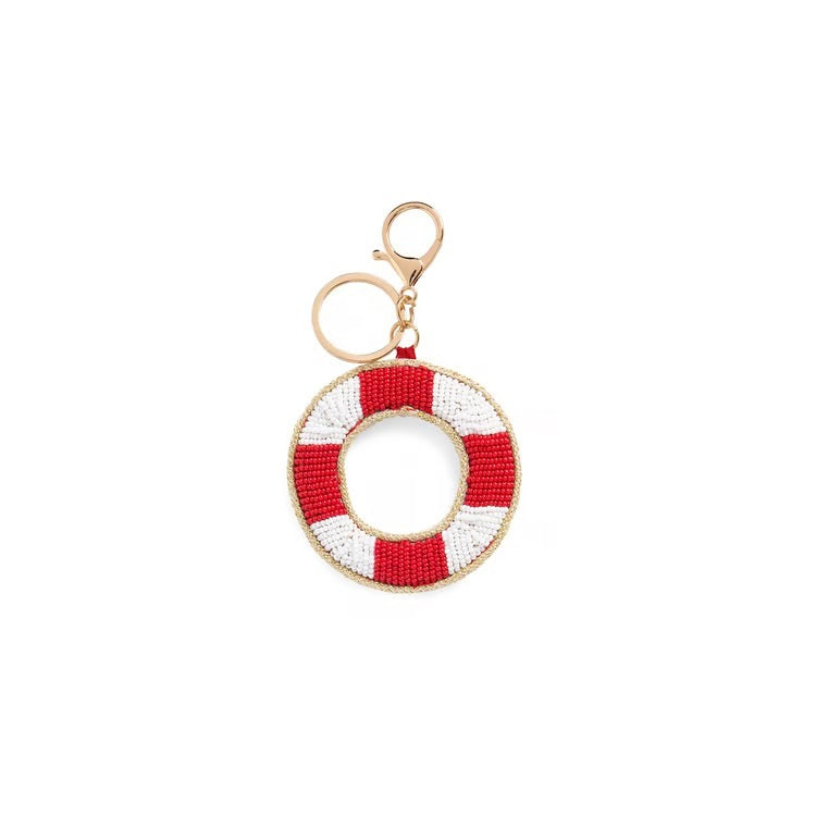 A beaded life preserver keychain charm featuring alternating red and white beaded stripes with a gold-tone metal clasp and key ring, shown on a plain white background.