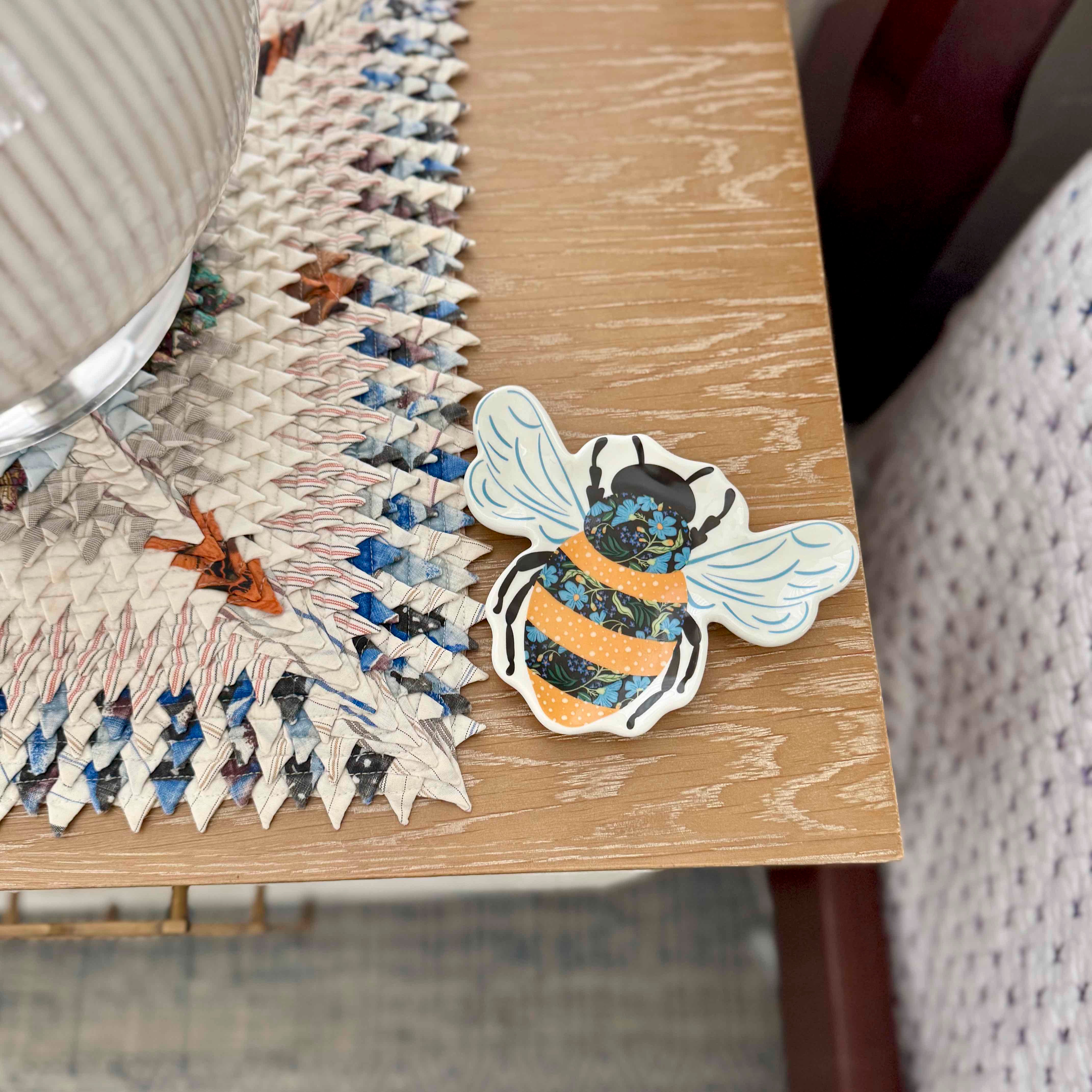 Jigsaw puzzle with a bee design on a wooden table