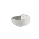 White ceramic bowl with textured surface on a white background