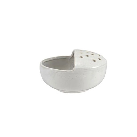 White ceramic bowl with textured surface on a white background