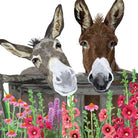 Two donkeys peering over a wooden fence with colorful flowers in the foreground.