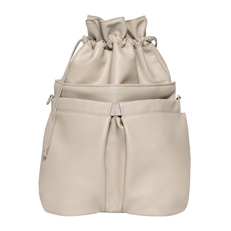 Beige drawstring bag with multiple compartments on a white background