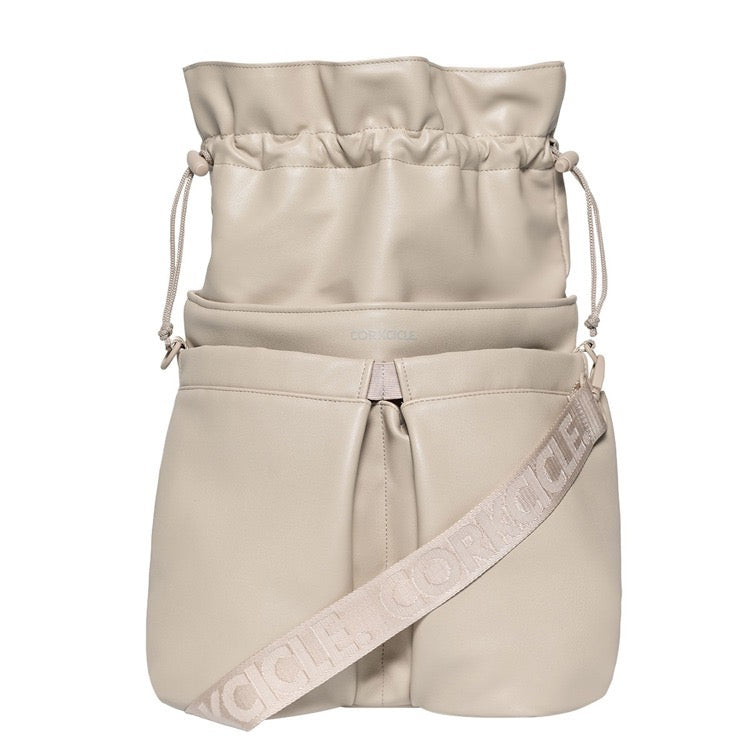 Beige drawstring bag with a strap featuring a logo on a white background