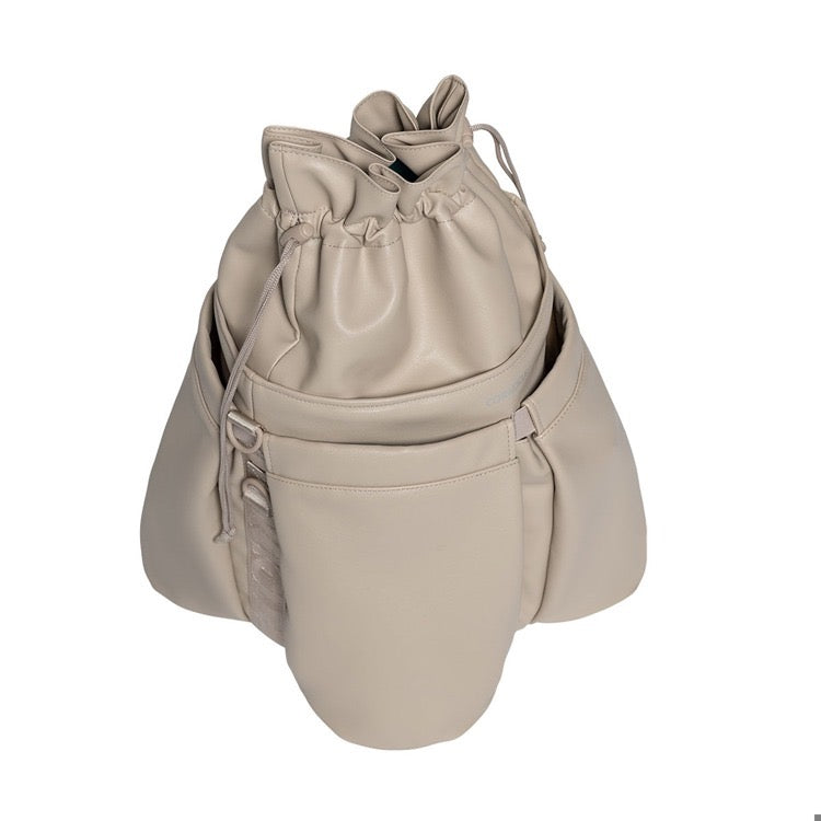 Beige drawstring bag on a white background