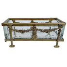 Decorative glass box with gold metal frame on a white background