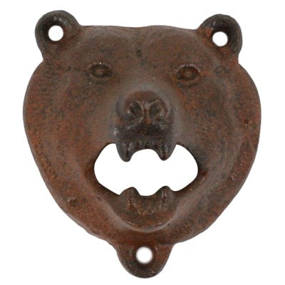 A rustic cast iron bear head bottle opener with a weathered brown and black patina, isolated on a white background.