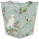 A freestanding rectangular trash can with a decorative printed panel featuring a white cockatoo, birds, butterflies, blossoms, and leaves on a pale blue-green background.