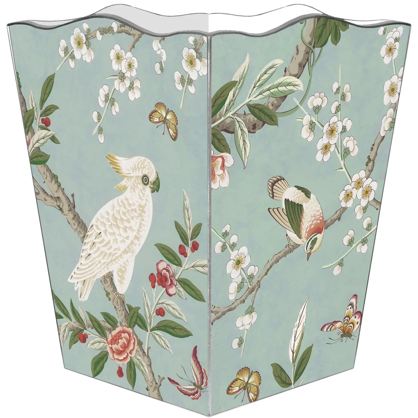 A freestanding rectangular trash can with a decorative printed panel featuring a white cockatoo, birds, butterflies, blossoms, and leaves on a pale blue-green background.