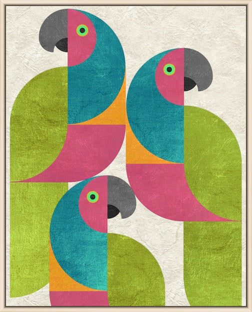 A framed art print featuring three stylized parrots in a geometric, color-blocked design. The parrots are composed of teal, magenta, lime green, orange, and dark gray shapes on a textured off-white background, enclosed in a thin light brown frame.