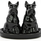 Black ceramic dog-shaped salt and pepper shakers on a matching tray.