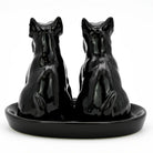 Black ceramic horse salt and pepper shakers on a matching tray.