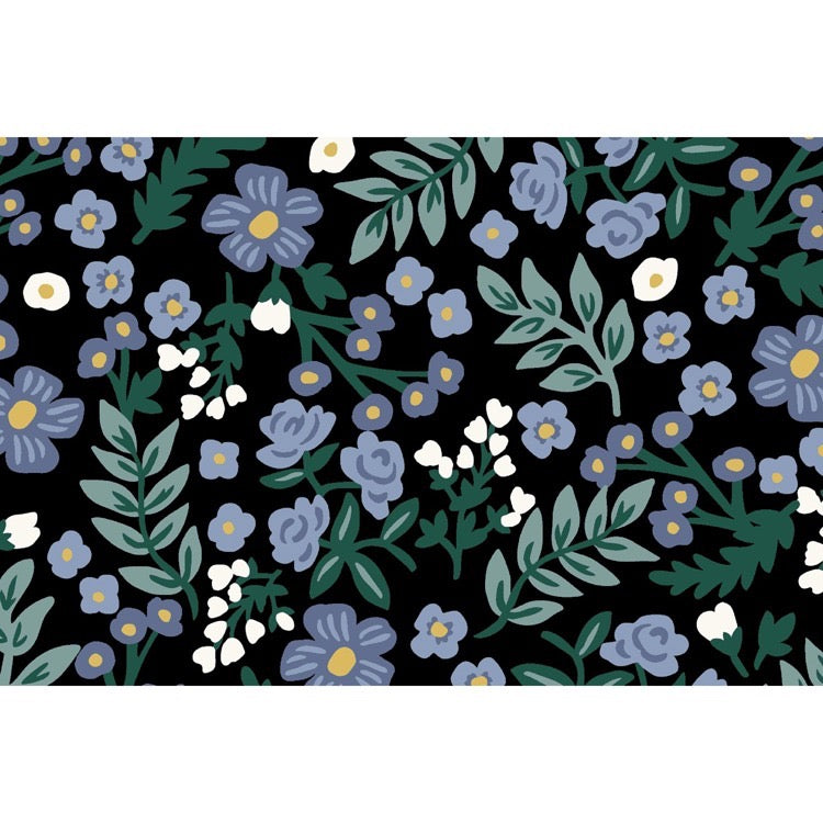 Floral pattern with blue and white flowers on a black background