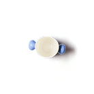 White ceramic cup with blue handles on a white background
