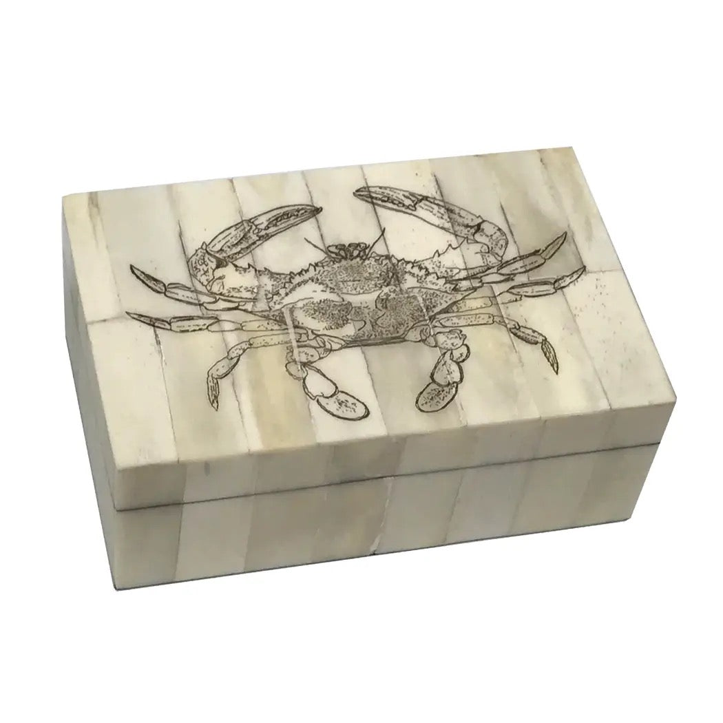Wooden box with a crab design on a white background