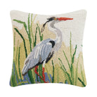 Decorative pillow with a heron design on a white background