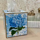 Tissue box cover with blue floral design on a neutral background