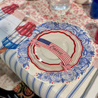 Decorative plate with American flag design on a floral tablecloth