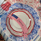 Decorative plate with American flag design and floral pattern