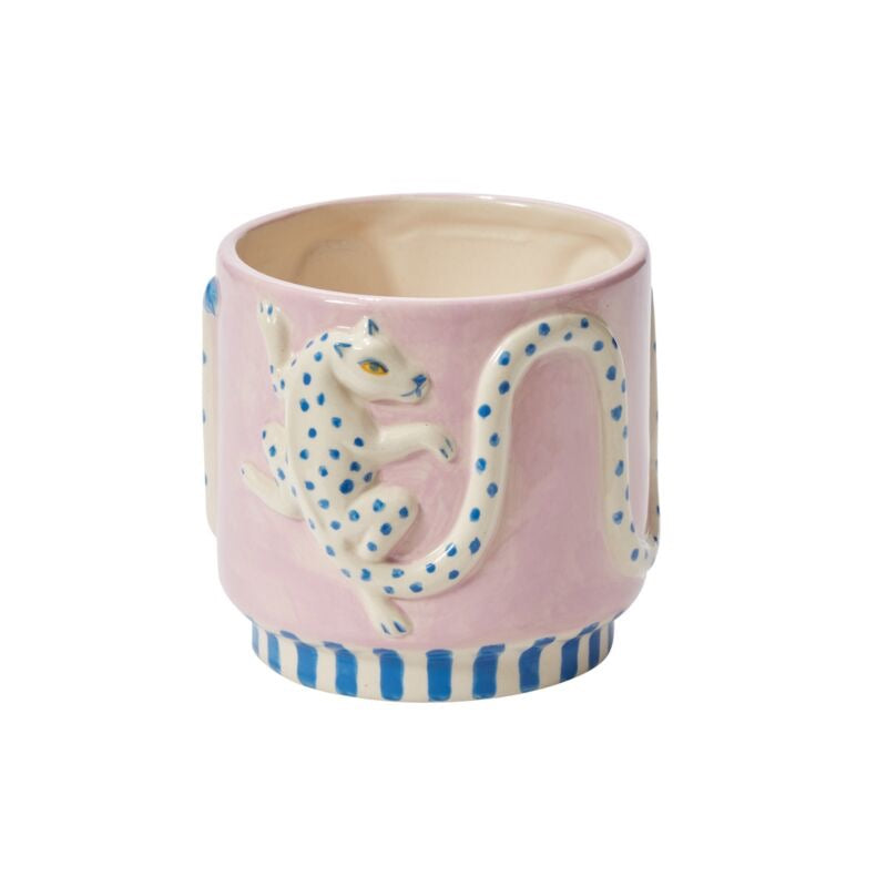 Pink mug with a white lemur design on a white background