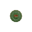Decorative plate with a boar design on a green background