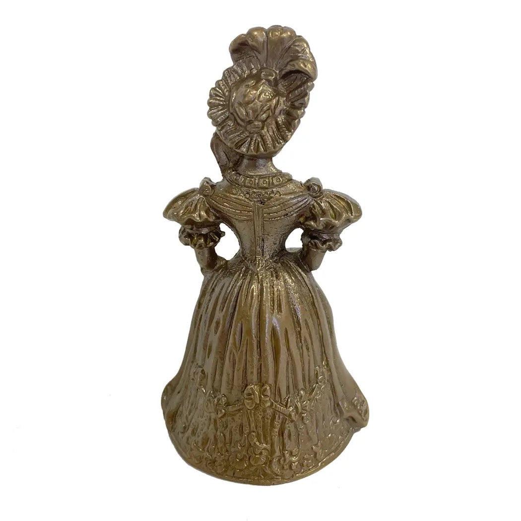 Bronze bell with decorative design on a white background