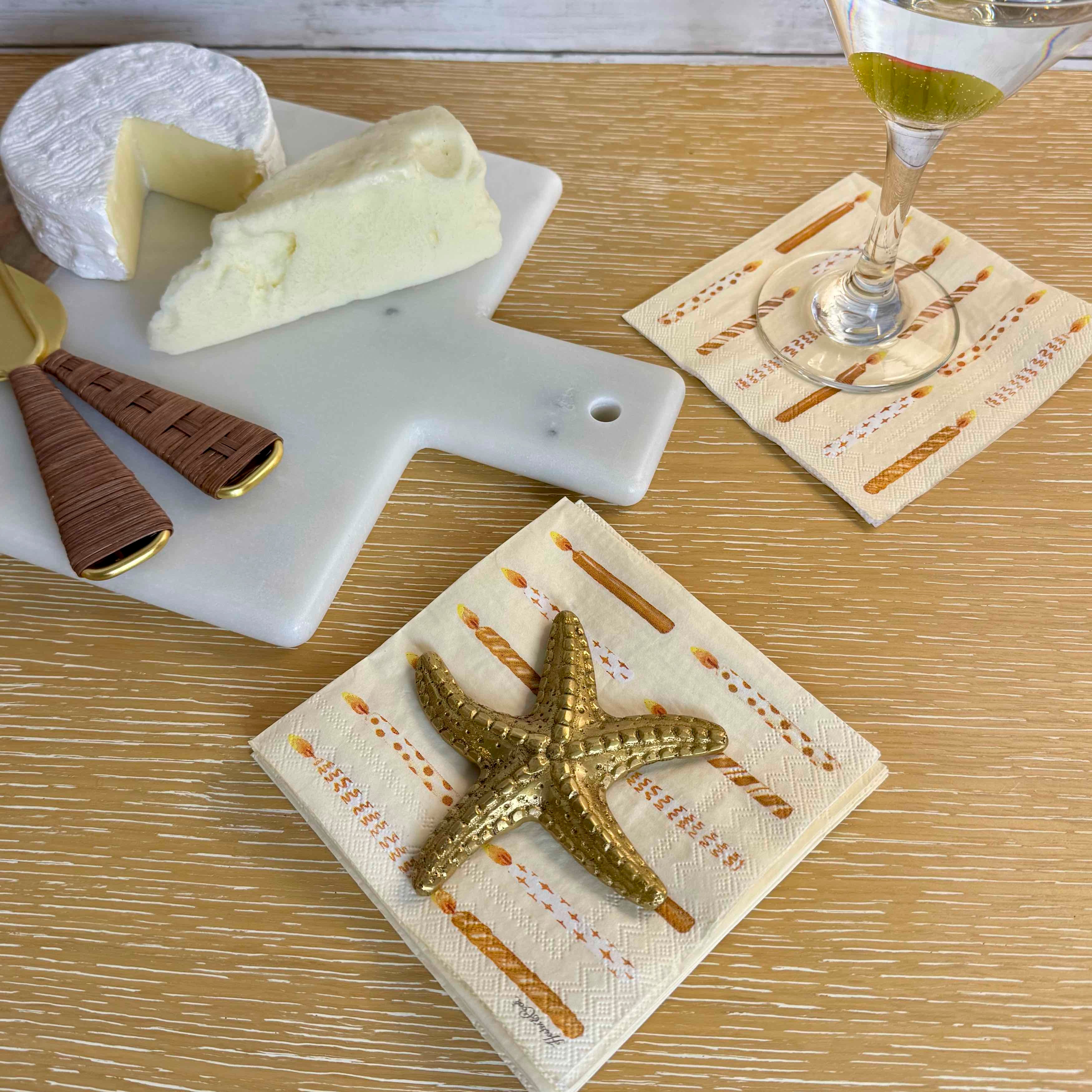 Cheese platter with starfish decor on a wooden table