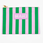 A pink and green vertically striped zippered pouch with a light pink patch on the front that reads 'MAHJ' in white letters, shown on a plain white background.