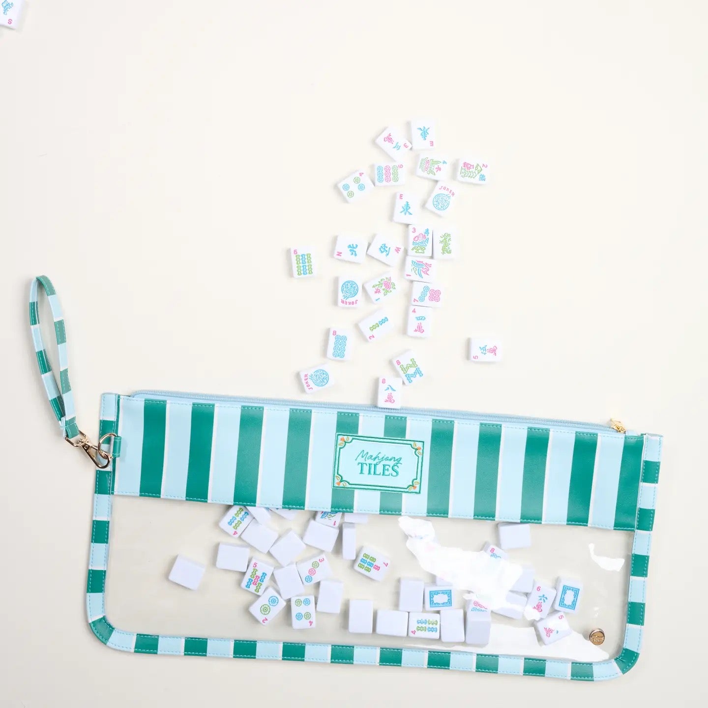 Striped pouch with magnetic tiles on a light background