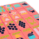 Set of colorful tiles with various symbols and text on a pink background