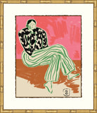 A framed art print featuring a stylized illustration of a seated person in a black-and-white patterned top and green striped pants against a pink and brown background, enclosed in a white mat and ornate gold frame.