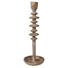 A rustic, multi-tiered metal candlestick holder with a distressed bronze and brown finish, set against a plain white background.