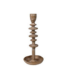 A rustic, multi-tiered wooden candlestick holder with a distressed finish, featuring a round base and a cup-shaped top, shown against a plain white background.
