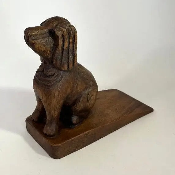Wooden dog figurine on a white background