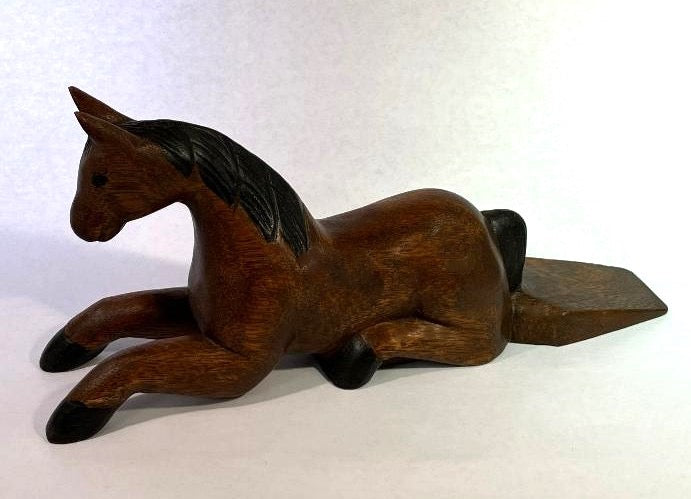 Wooden horse figurine on a white background