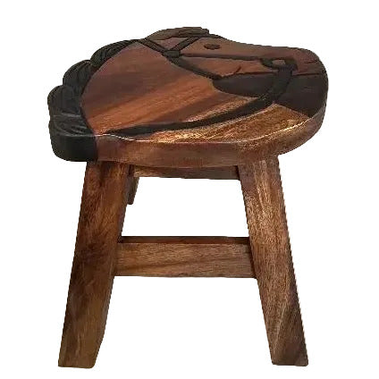 A rustic wooden stool with a carved seat featuring a horse design, finished in dark brown wood with black painted accents.