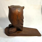 Wooden owl bookend on a white background