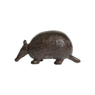 Bronze armadillo figurine on a white background