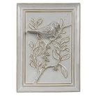 Decorative wall tile with a bird and branch design on a white background