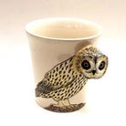Ceramic mug with an owl design on a white background