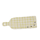 Rectangular cutting board with yellow grid pattern and black ants on a white background