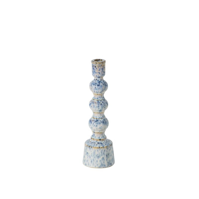 A tall, multi-tiered ceramic candlestick holder with a textured blue and white speckled glaze and subtle gold accents, set against a plain white background.