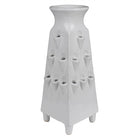 White ceramic vase with geometric design on a white background